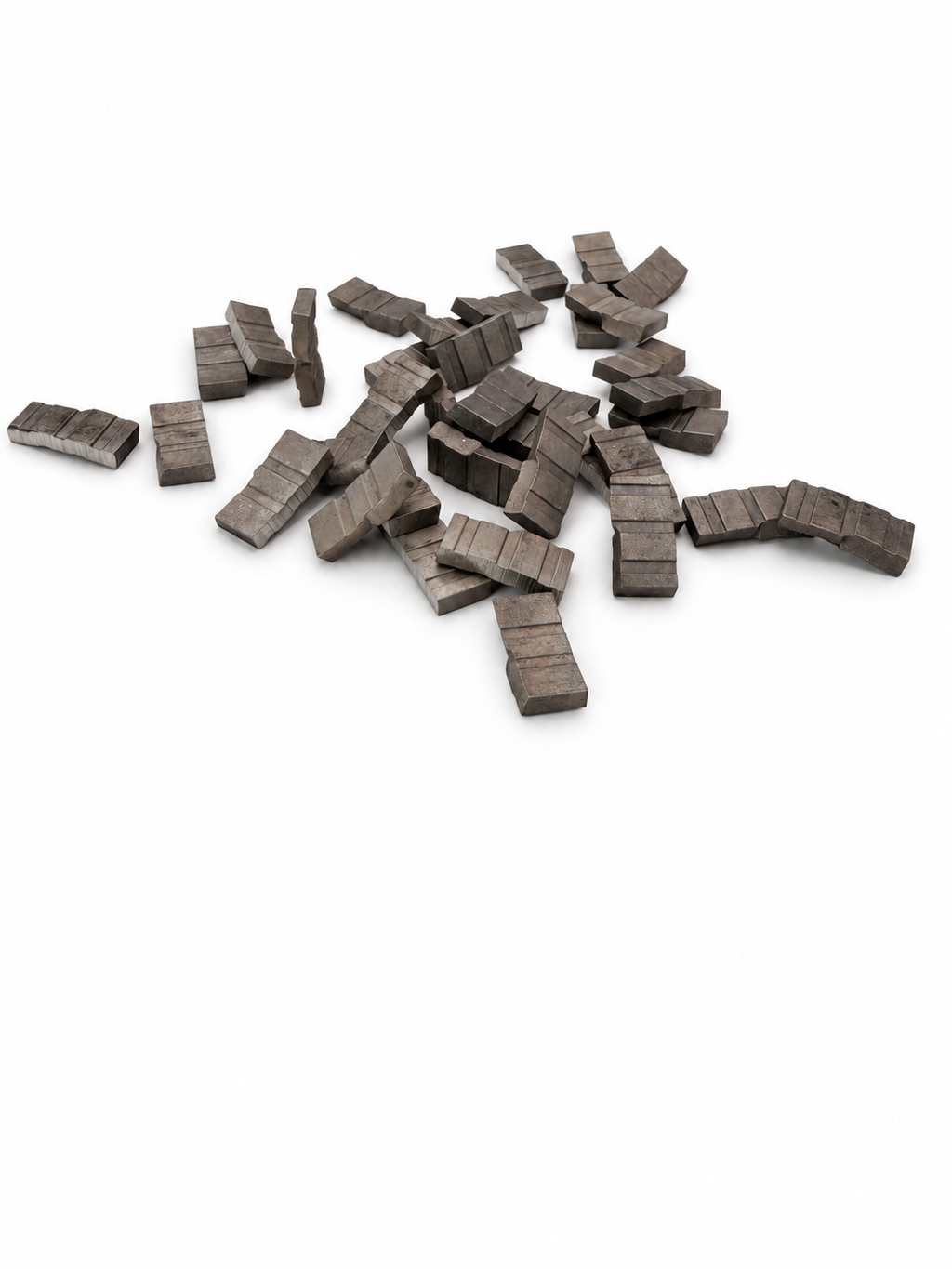 X-Top loose diamond core drill segments with grooved roof tops, shown as a representative batch